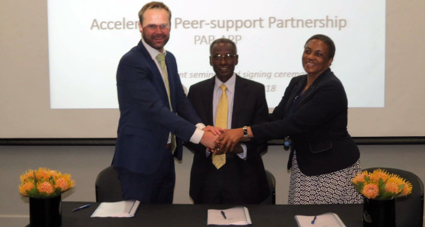 Signing ceremony with representatives from IDI, SAI Eritrea, and AFROSAI-E